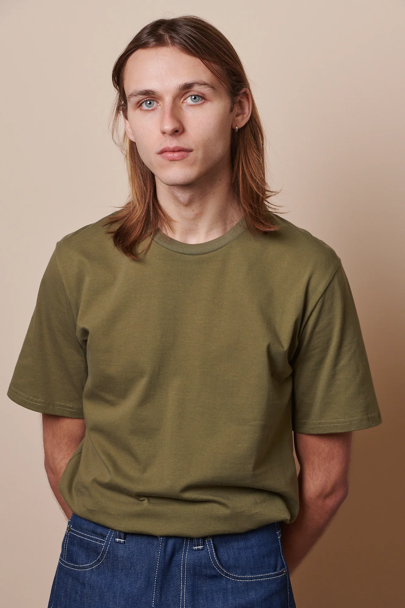 Community Clothing olive T-shirt used as the repeat base layer in a travel capsule
